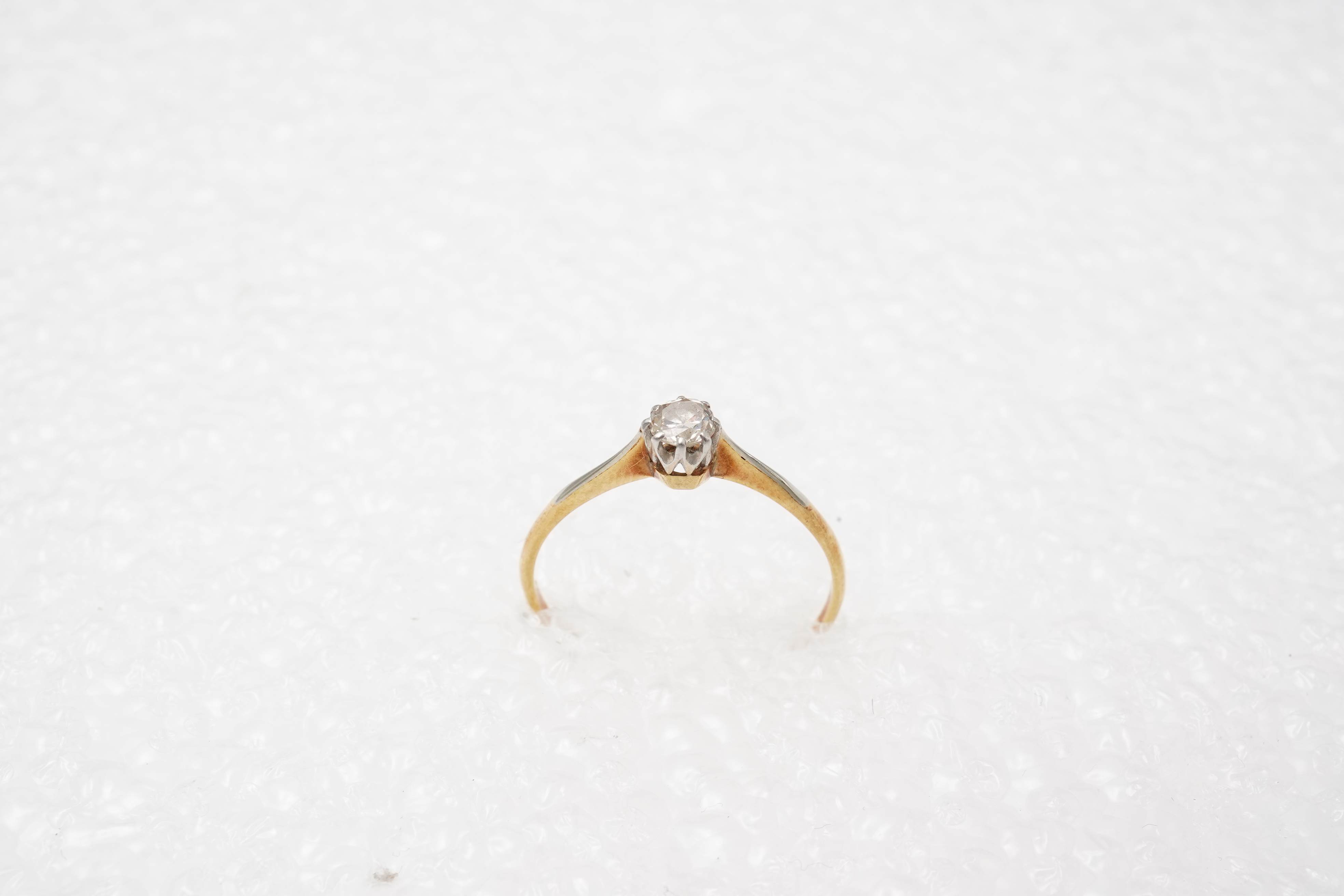 A small solitaire diamond ring, early 20th century